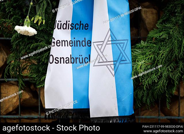 16 November 2023, Lower Saxony, Osnabrück: A ribbon reading ""Jewish community of Osnabrück"" can be seen at a memorial site