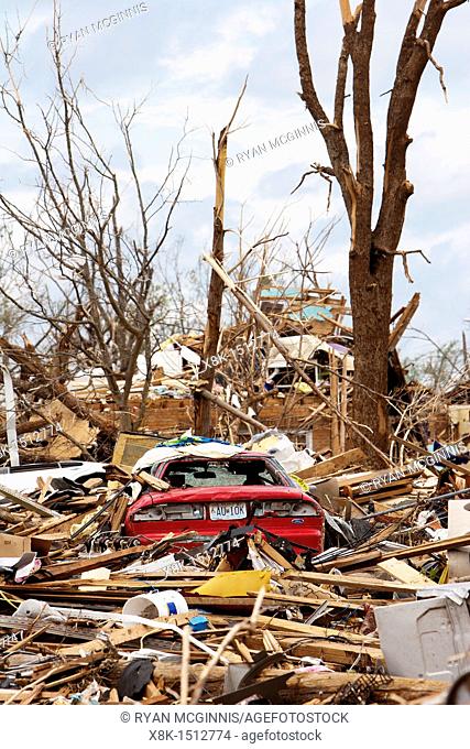 Cars lay buried in rubble in what remains of a residential area in Joplin, Missouri, May 25, 2011  On May 22, 2011, Joplin Missouri was devastated by an EF-5...