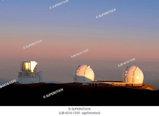 The Subaru Telescope and the Twin Telescopes of the W. M. Keck Observatory Above the Clouds at the Summit of Hawaii's Mauna Kea