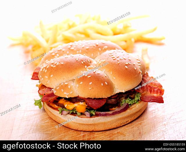 Big burger and chips on the table