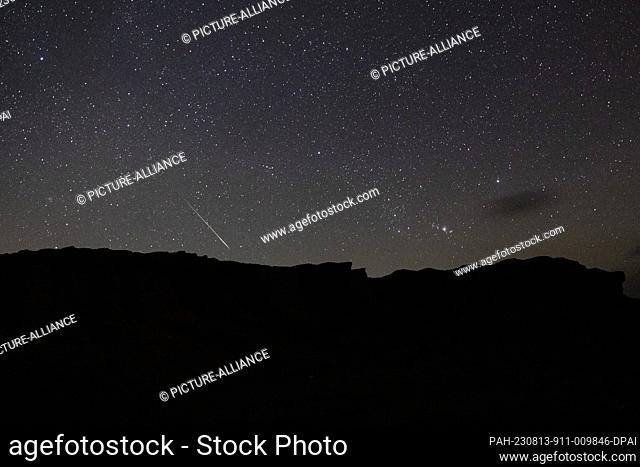 12 August 2023, Egypt, Faiyum: A Picture taken on 12 August shows the Perseid meteor shower over the natural reserve area of Wadi Al-Hitan (Valley of the...