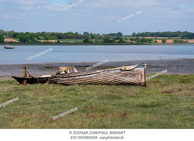 Wooden boat aground in estuary