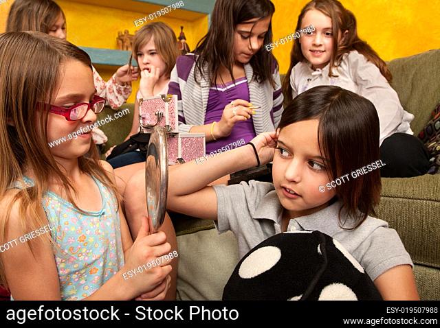 Little Girls Fixing Their Hair