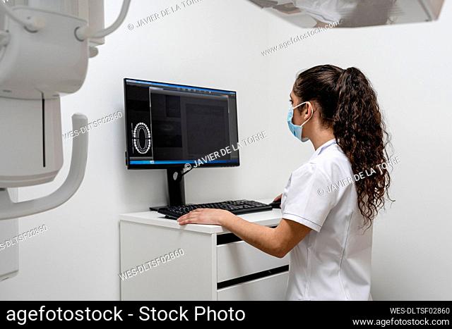Nurse working on computer in maxillofacial clinic