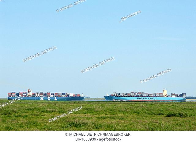 Two container vessels passing one another on the lower Elbe River, Schleswig-Holstein, Germany, Europe
