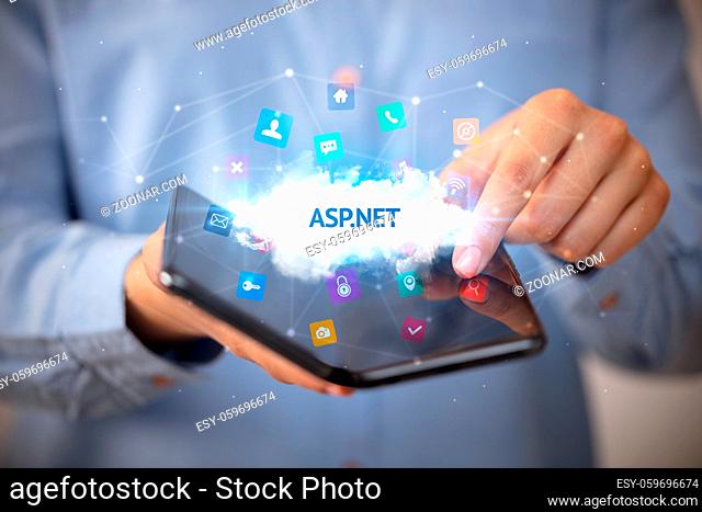 Businessman holding a foldable smartphone with ASP.NET inscription, technology concept
