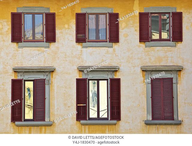 Weathered Windows with Red Shutters of Florence