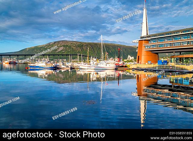 Skyline with the harbor, bridge and arctic cathedral of Tromso in northerm Norway
