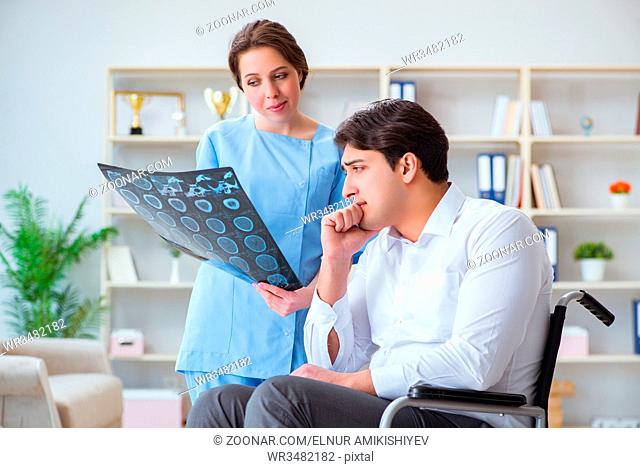 Doctor discussing x-ray image with patient