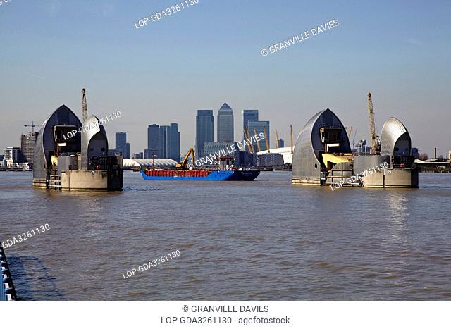 England, London, Woolwich. View over the River Thames of the Thames Barrier, O2 and skyscrapers in Canary Wharf