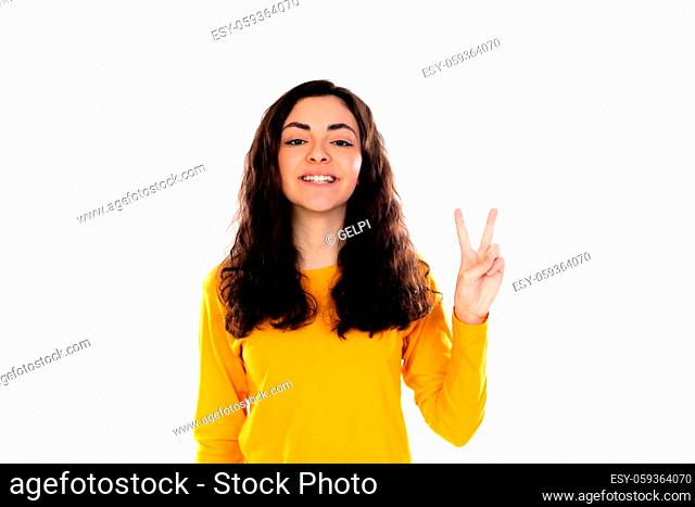 Adorable teenage girl with yellow sweater isolated on a white background