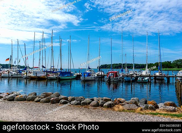 Nysted, Denmark - 11 June, 2021: view of the harbor front promenade and marina and yacht harbor in Nysted