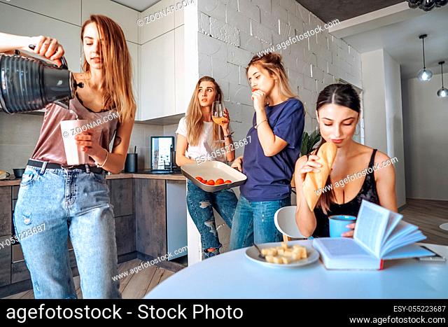 group of women have fun in the kitchen