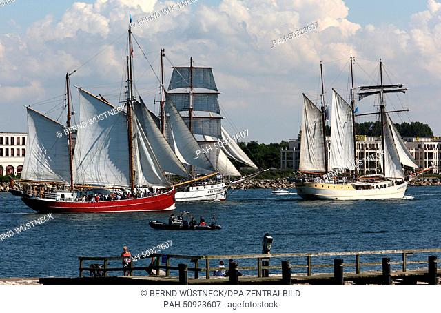 After a sailing trip on the Baltic Sea the traditional and the museum ships of the Hanse Sail return to the harbour in Rostock-Warnemuende, Germany