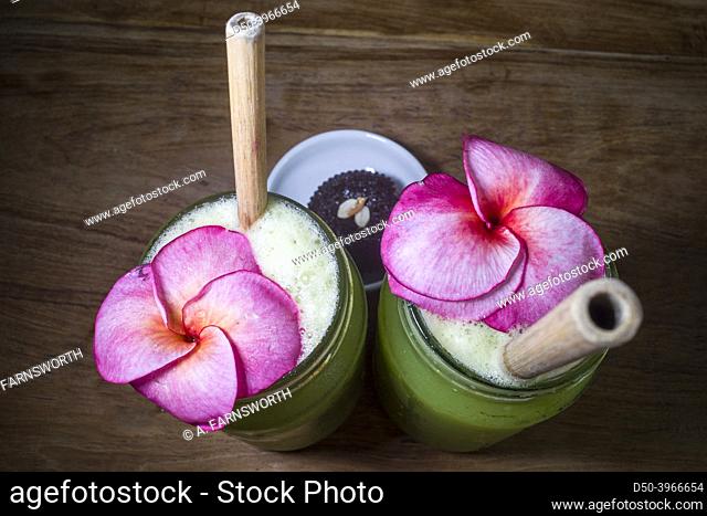 Galle, Sri Lanka An exotic ginger spinach drink is served with a flower and a cookie and a wooden straw