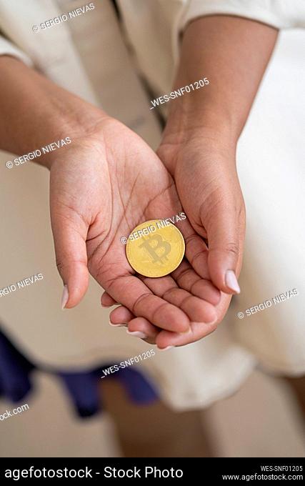 Woman holding cryptocurrency