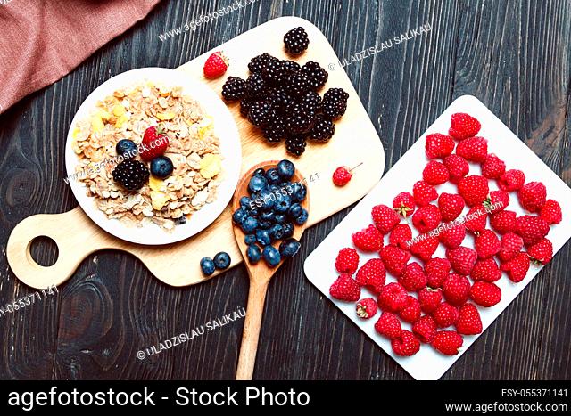Cereal. Breakfast with muesli and berries. Top view