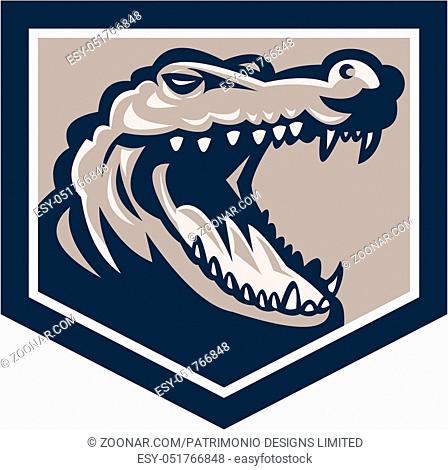 Illustration of an angry alligator crocodile head snout snapping set inside shield done in retro style on isolated background