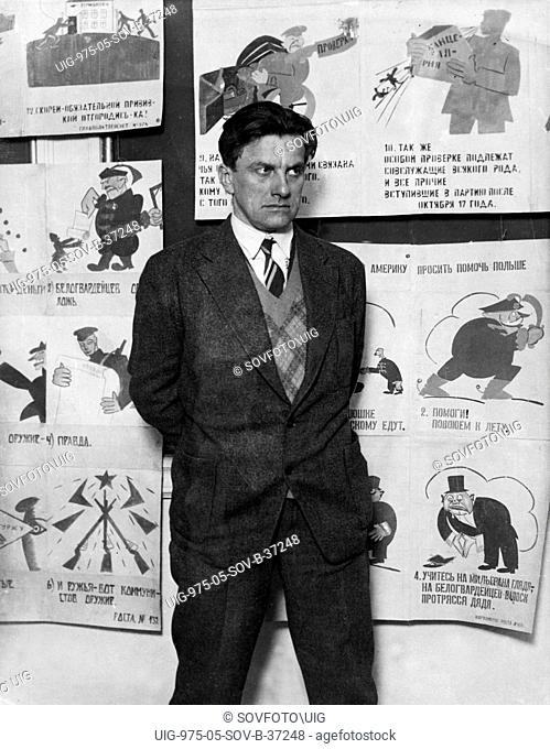 Vladimir mayakovsky, soviet poet, playwright and graphic artist (1894-1930) with some of his propaganda posters, this photo was taken two months before his...