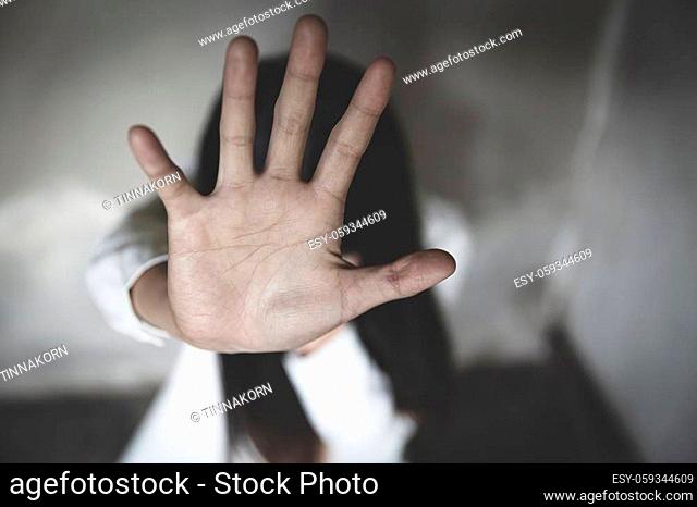 woman using hand palm to stop. stop violence against women campaign concept with copy space