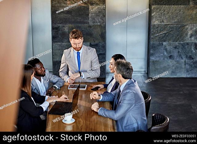 Business people having a meeting in hotel lobby