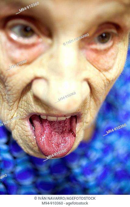Old woman showing her tongue