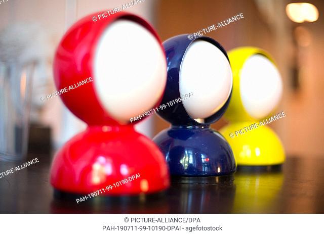 02 July 2019, Germany (German), Berlin: Three table lamps by Vico Magistretti with the name ""Eclisse"" stand in an apartment