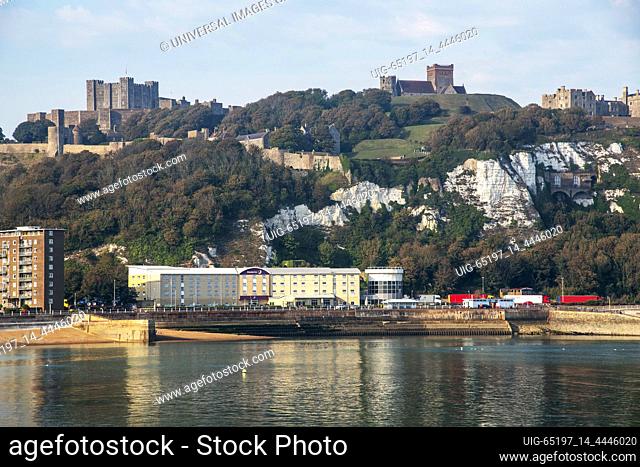 Dover, Kent, England, UK. 2020. View from the western docks of Dover Castle and White Cliffs and hotel on the beach