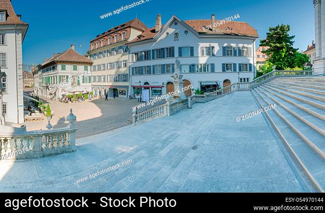 Solothurn, SO / Switzerland - 2 June 2019: historic old town in the Swiss city of Solothurn with a view of the Hauptgasse near Saint Ursern Cathedral