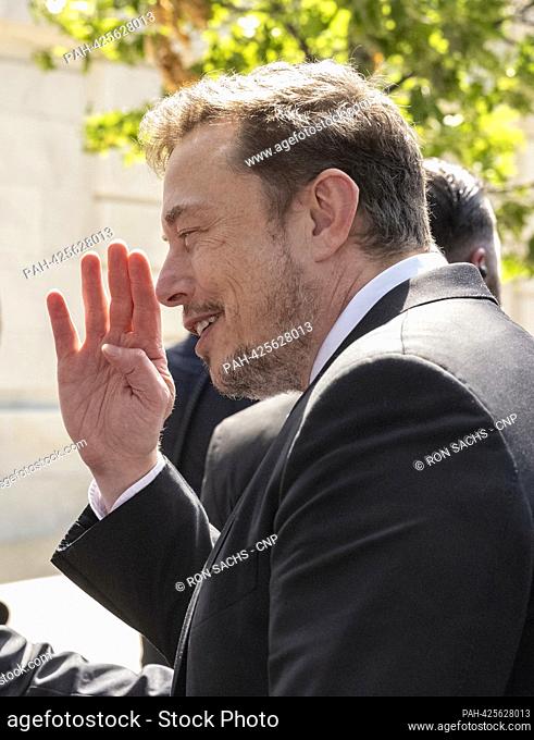 Elon Musk, Chief Executive Officer, Tesla, SpaceX and X (previously known as Twitter) waves farewell to the media following his appearance at the United States...