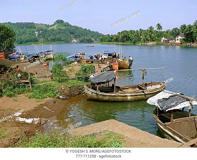 Wooden fishing boats at a small harbor called Bhaucha Dhakka  Chiplun, Ratnagiri, Maharashtra, India