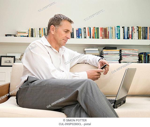 Businessman sitting at his laptop