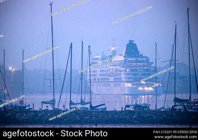 16 September 2020, Mecklenburg-Western Pomerania, Wismar: The cruise ship ""Europa"" enters the port of the Hanseatic city in the fog