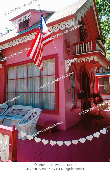 Massachusetts, Martha'S Vineyard, Oak Bluffs.House With Wicker Furniture And American Flag On Porch