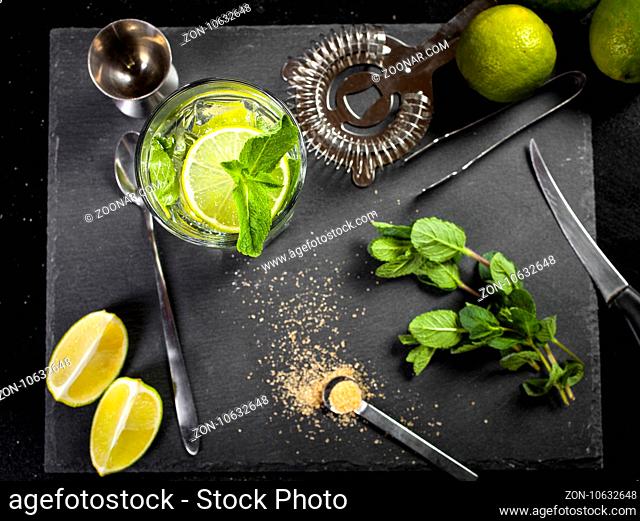 Mojito cocktail making. Ingredients and bar utensils