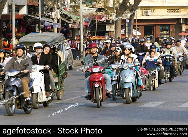 Motorcycles crowd streets of Hanoi Vietnam