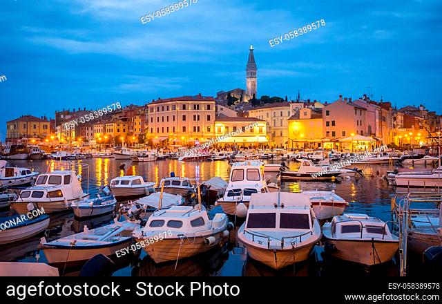 view of Rovinj in Croatia with boats at the port