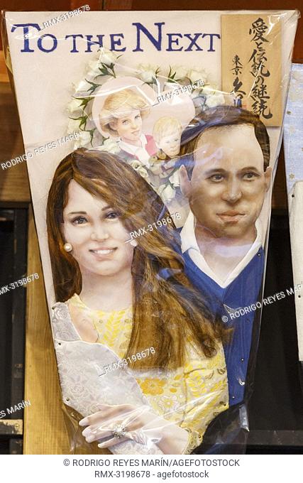 A Hagoita (Battledore) decorated with the faces of Catherine Duchess of Cambridge (L), Prince William Duke of Cambridge (R) and Diana Princess of Wales (up) on...