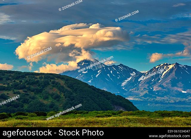 Dramatic spectacular lenticular cloud formation over volcano on Kamchatka peninsula, Russia