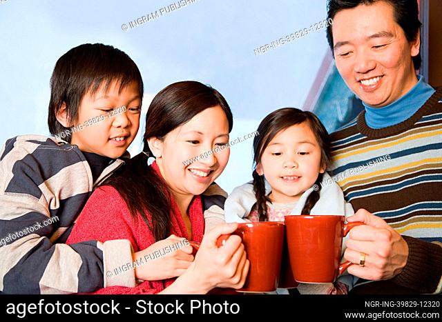 Family having hot drinks