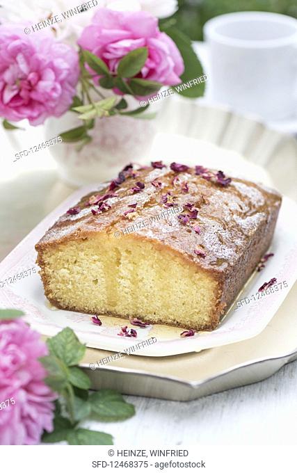 Drizzle cake with rose water and roses, sliced
