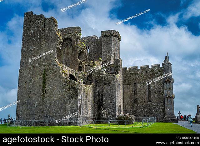 Cashel, Ireland, August 2019 Tourists admiring and sightseeing majestic ancient ruins of Rock of Cashel castle
