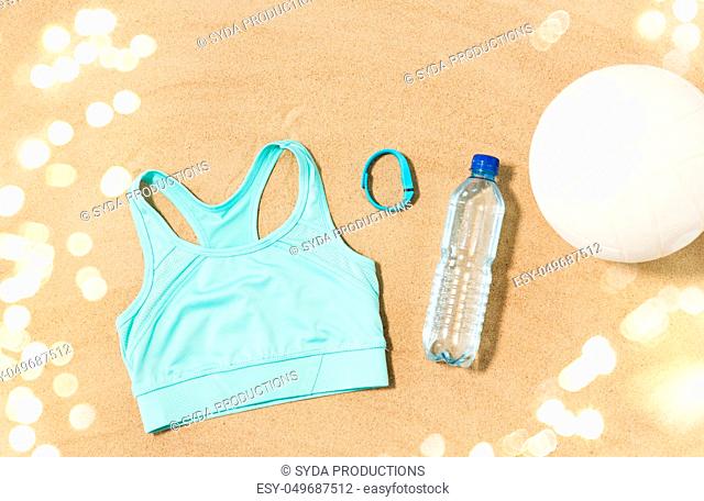 sports top, ball, fitness tracker and water bottle