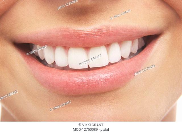 Woman's open mouth perfect teeth