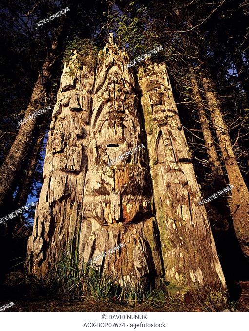 triple totem pole at kiusta village,  haida gwaii, British Columbia, Canada