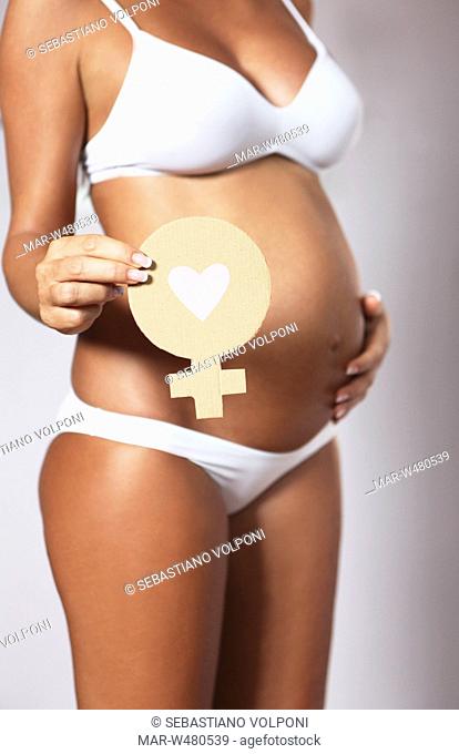 donna incinta con il simbolo femminile