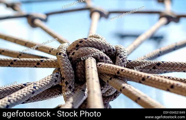 many ropes and one big knot black and white abstract background close up