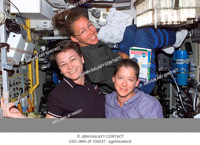 Astronauts Peggy A. Whitson (left), Expedition Five flight engineer; Sandra H. Magnus, STS-112 mission specialist, and Pamela A