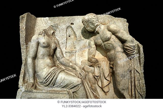 Close up of a Roman Sebasteion relief sculpture of Io and Argos Aphrodisias Museum, Aphrodisias, Turkey. Against a black background.