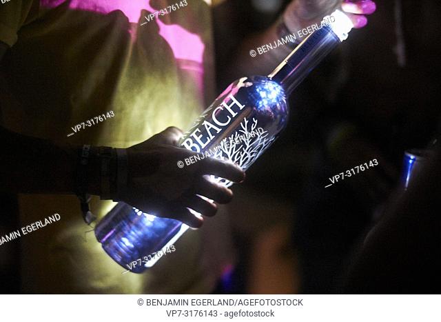 hand holding Belvedere Vodka bottle at music festival Starbeach Chersonissos, Crete, Greece, at 06. August 2018